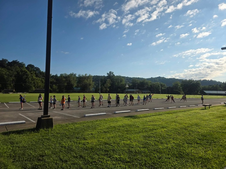 student on field for band drills