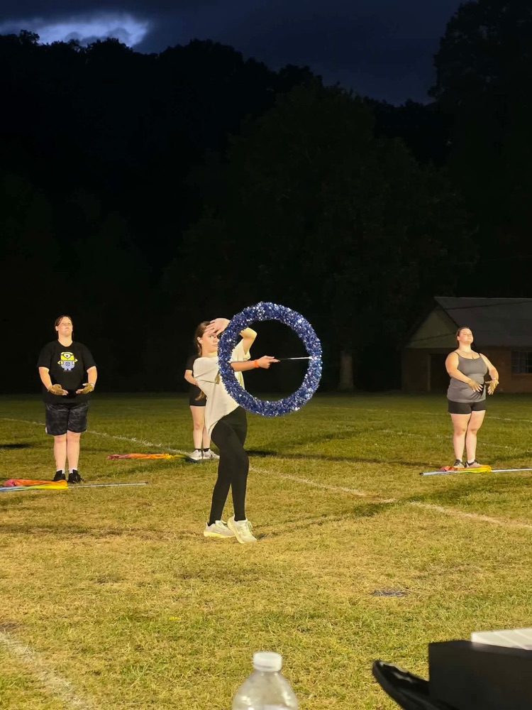 majorette twirling a hoop baton