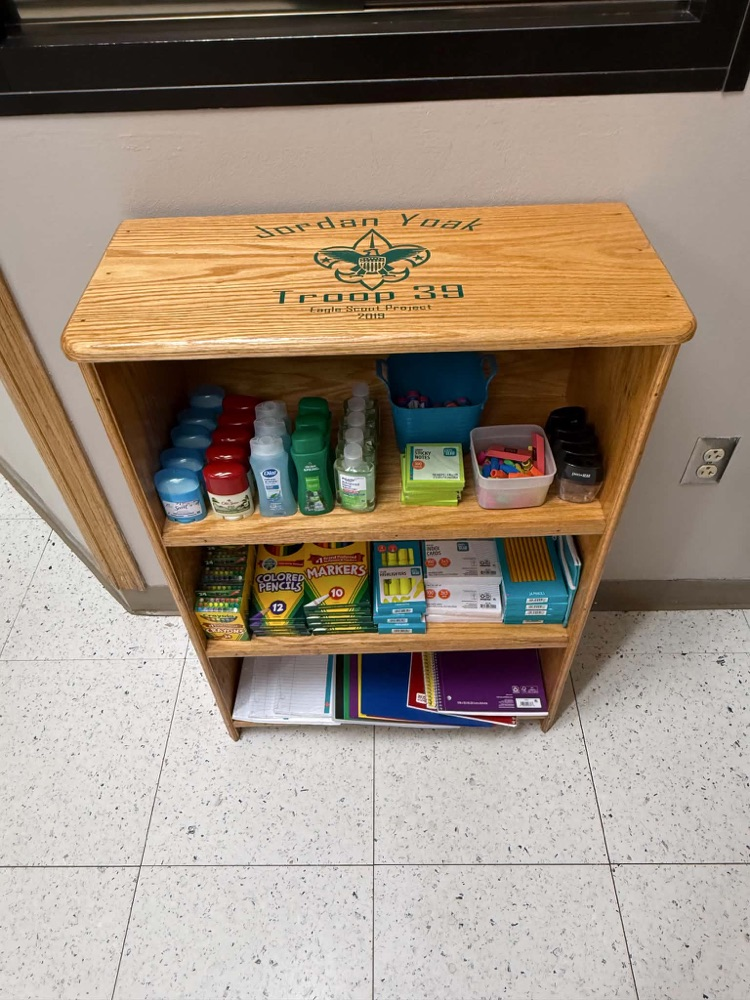 shelves filled with school supplies. 