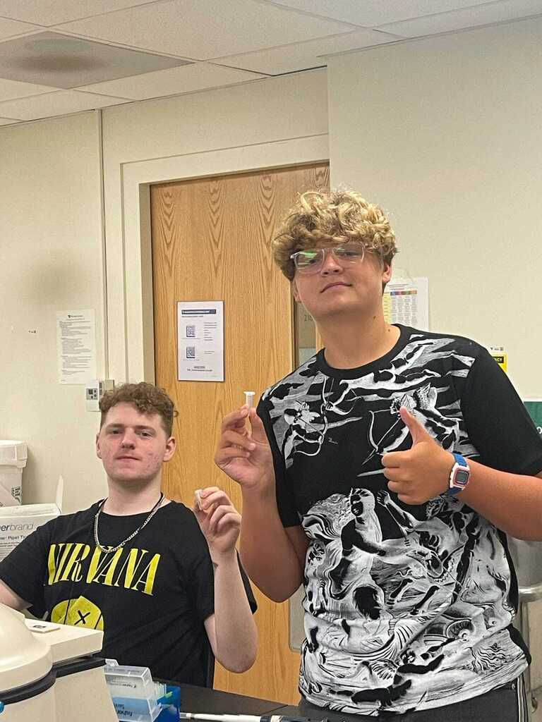 Teammates working the lab