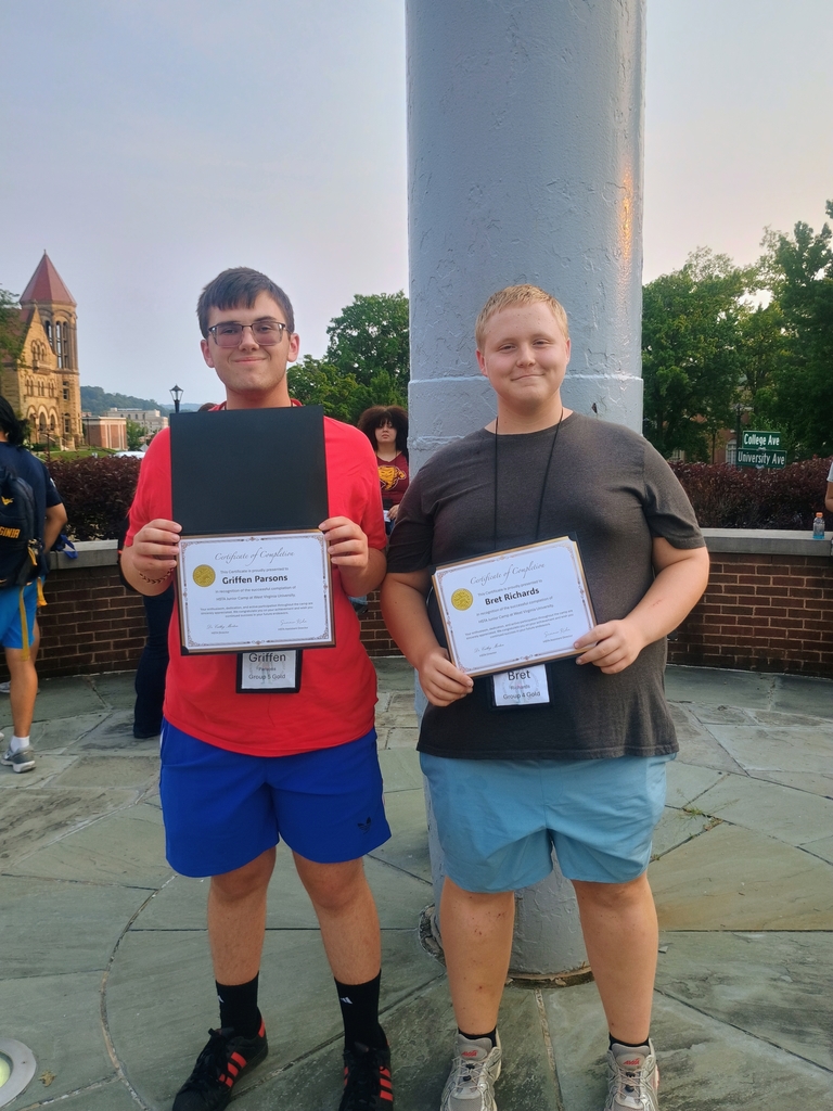 Griffen and Bret standing with  awards