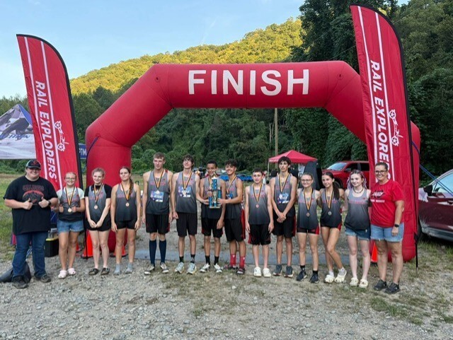 All Runners for CCMHS standing at the finish line with medals