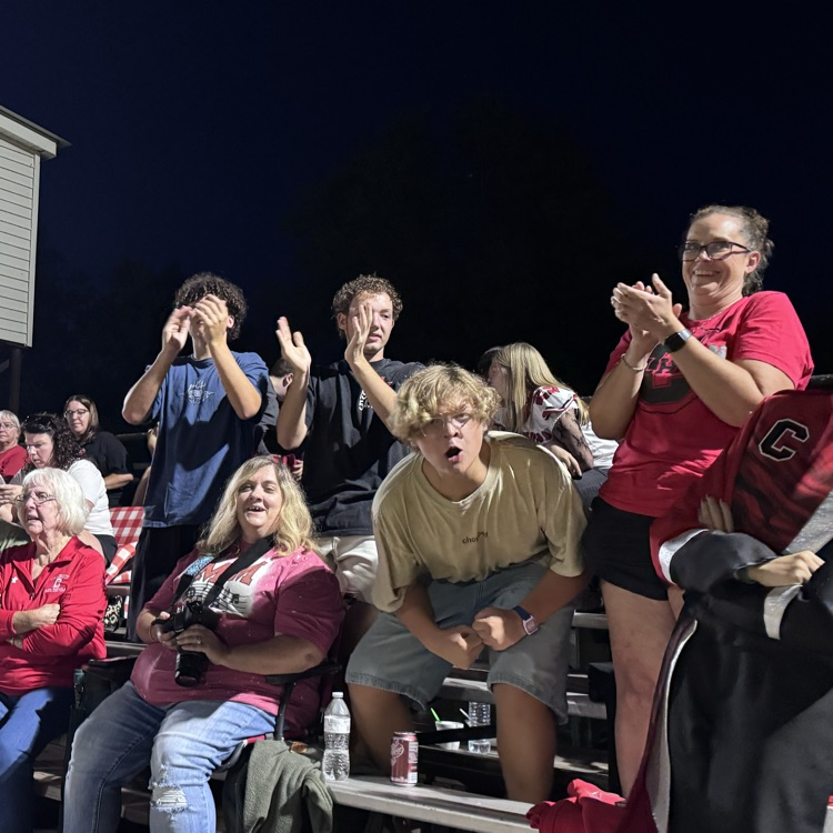 fans cheering in the stands, students section, is cheering.