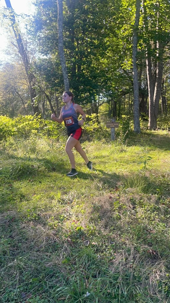 Carissa running through the woods