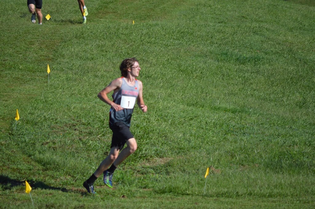 Runner cutting the turn to go back up the hill 