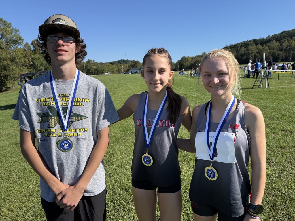 3 High School team members with awards