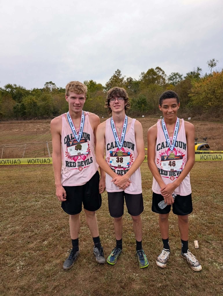 High School boys pose with medals