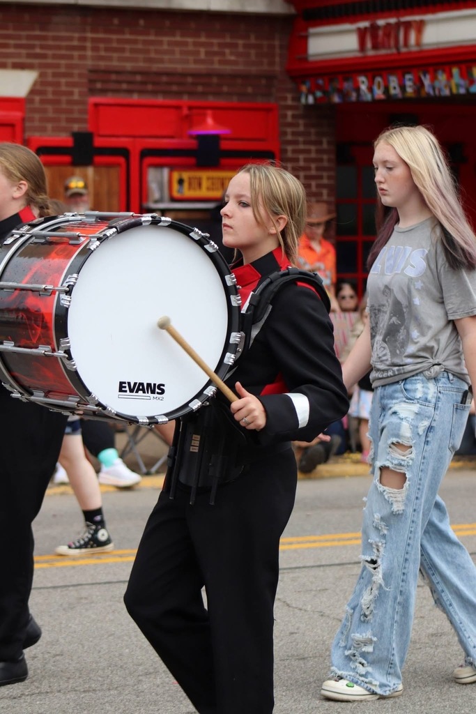 bass drum player preforming in the parade