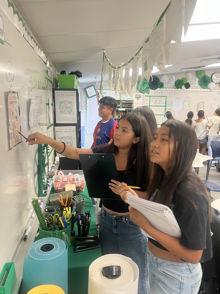2 students seeing the one pagers