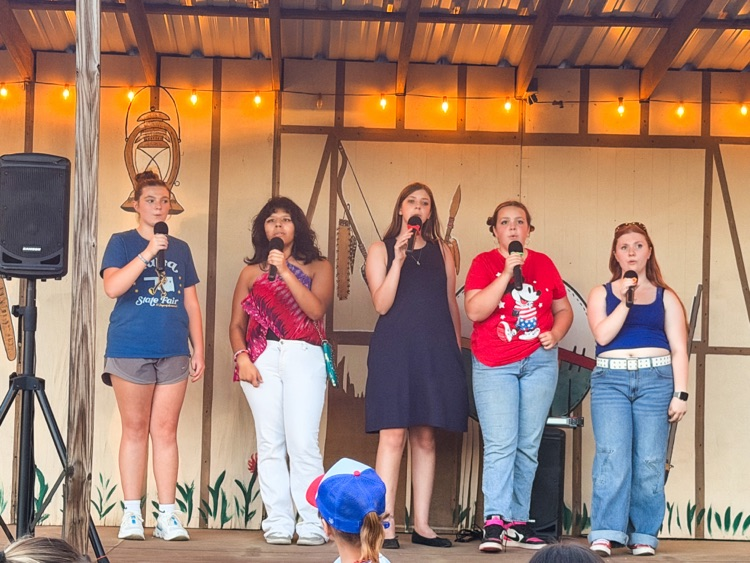 Girls singing God Bless the USA