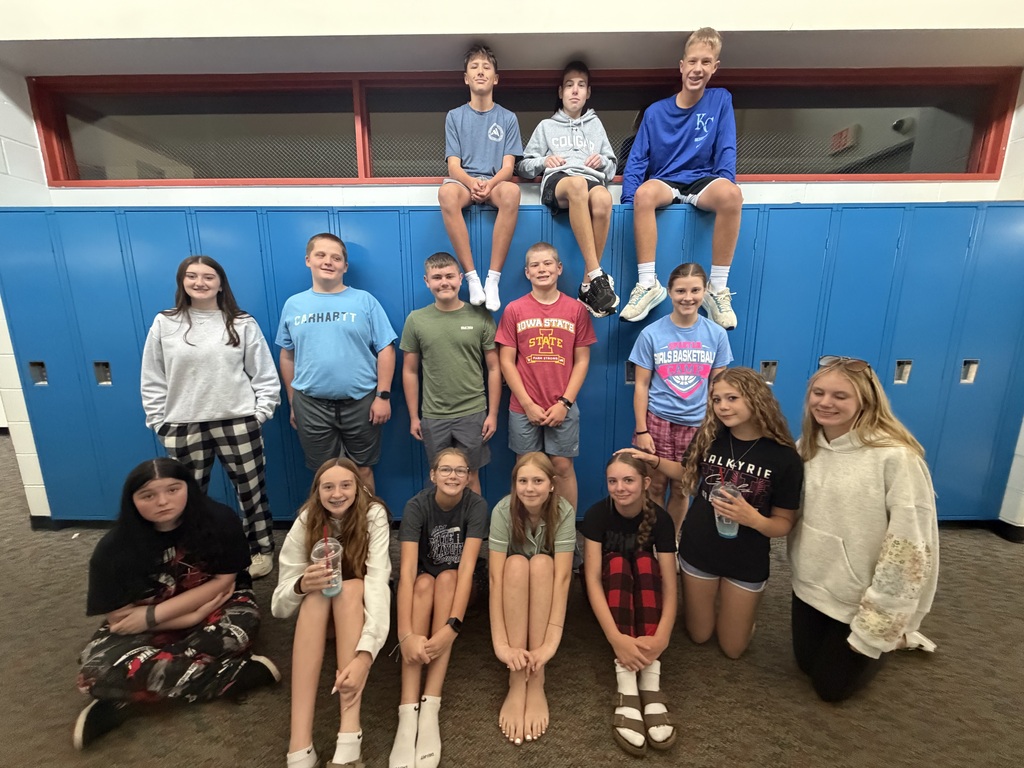 Freshman in their PJ's in the hallway they are decorating at the school.