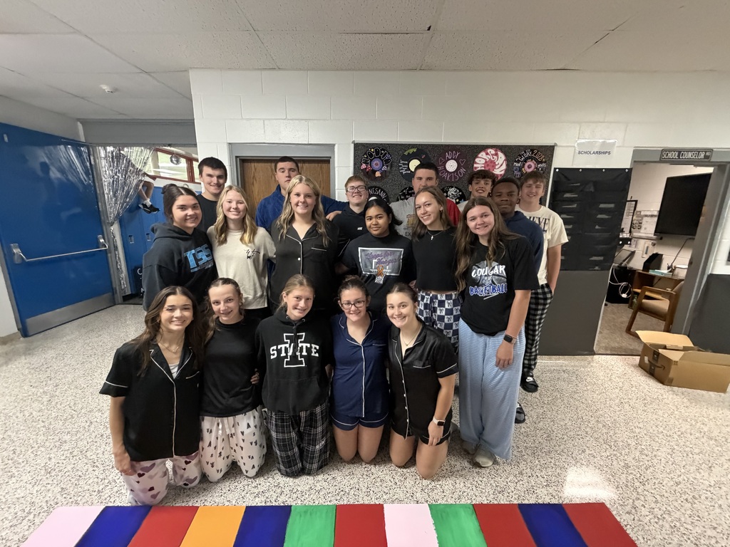 Junior Class in their PJ's in the hallway they are decorating at the school.