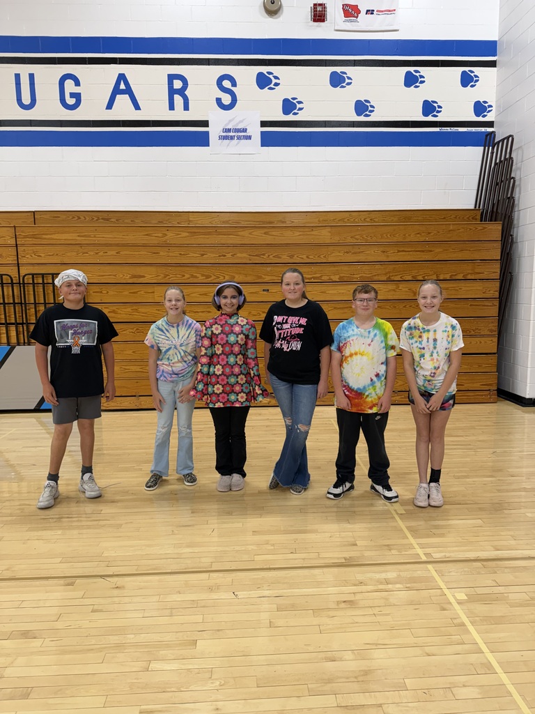 7th and 8th graders dressed in their Jazz and Disco outfits the gym