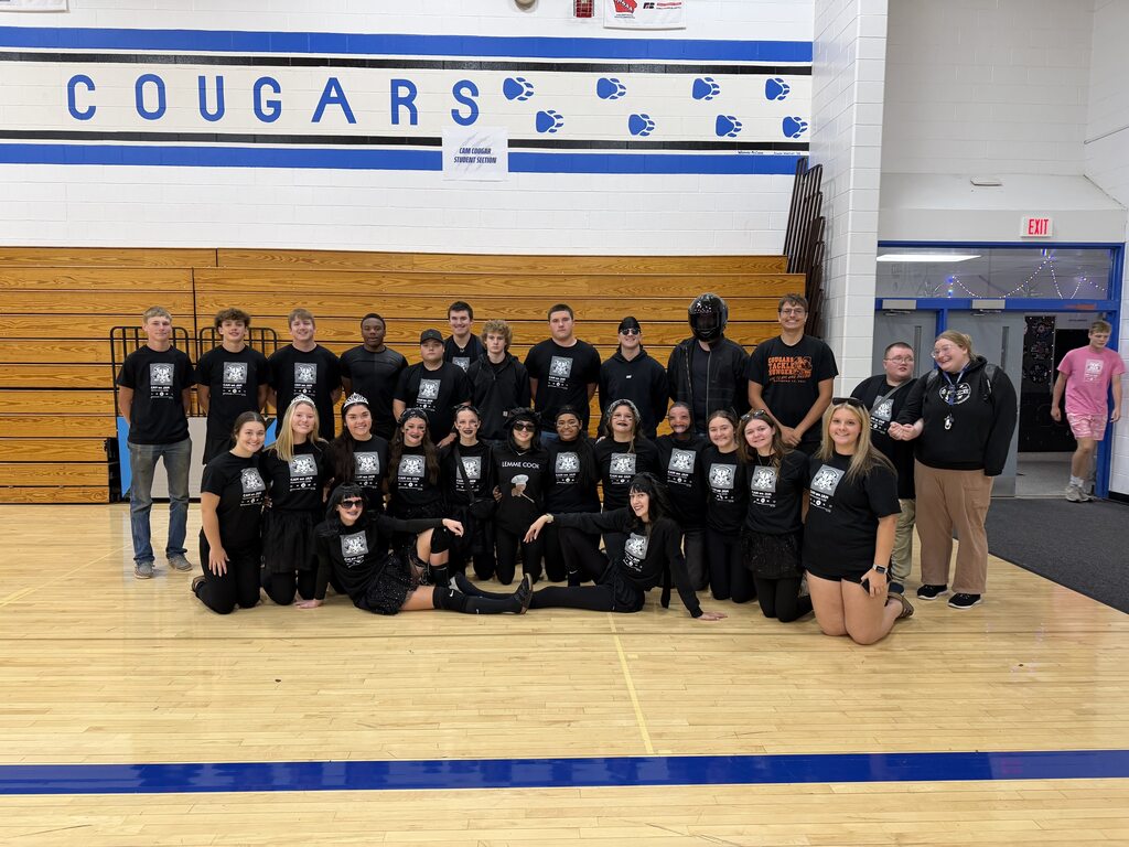 Juniors class dressed in black in the gym