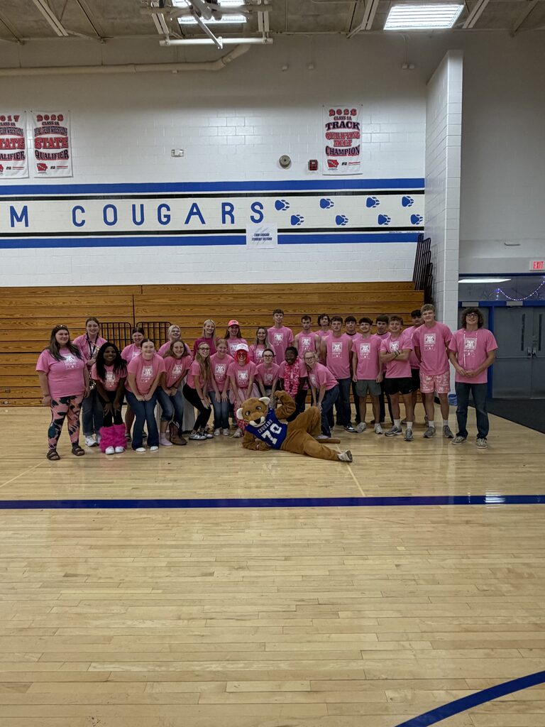 Senior class dressed in pink in the gym