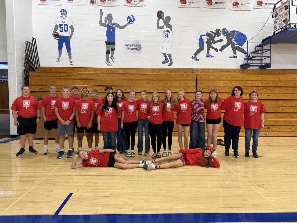 Freshman class dressed in red in the gym