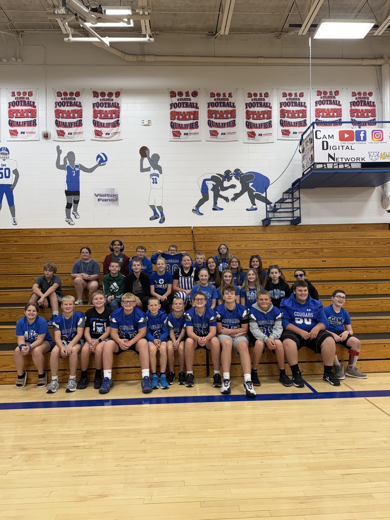 7th graders dressed in blue in the gym