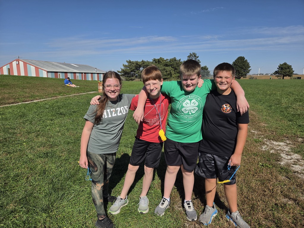 Four friends having fun walking and running at the mileage club