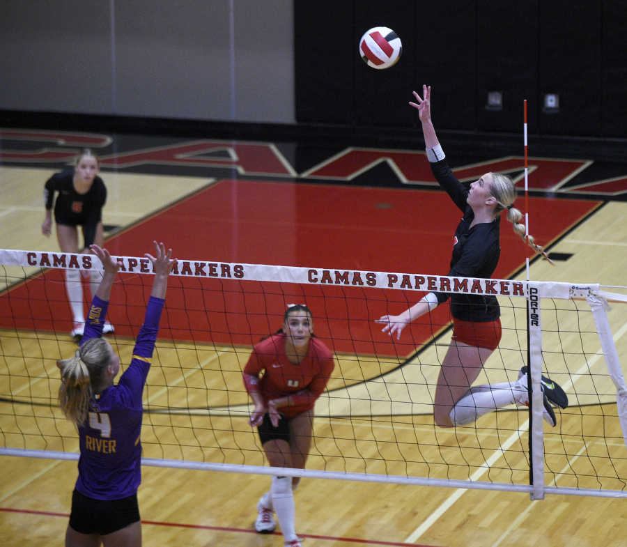 Athletes playing volleyball