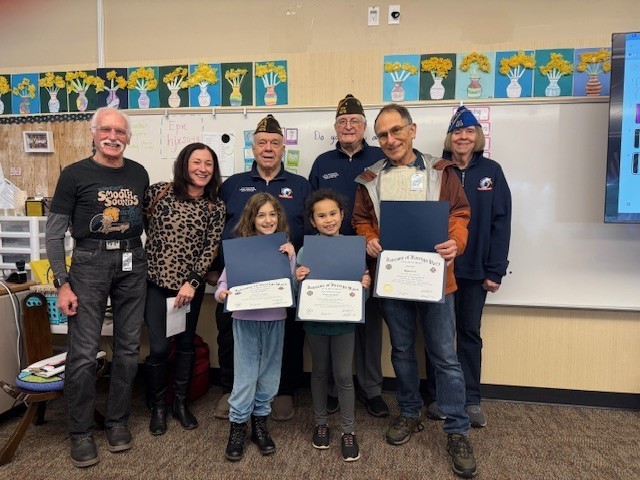 Students with award certificates