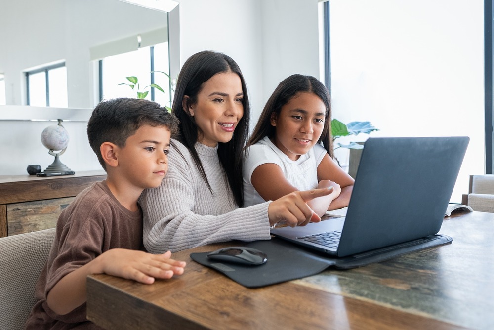 Image of students learning with an adult