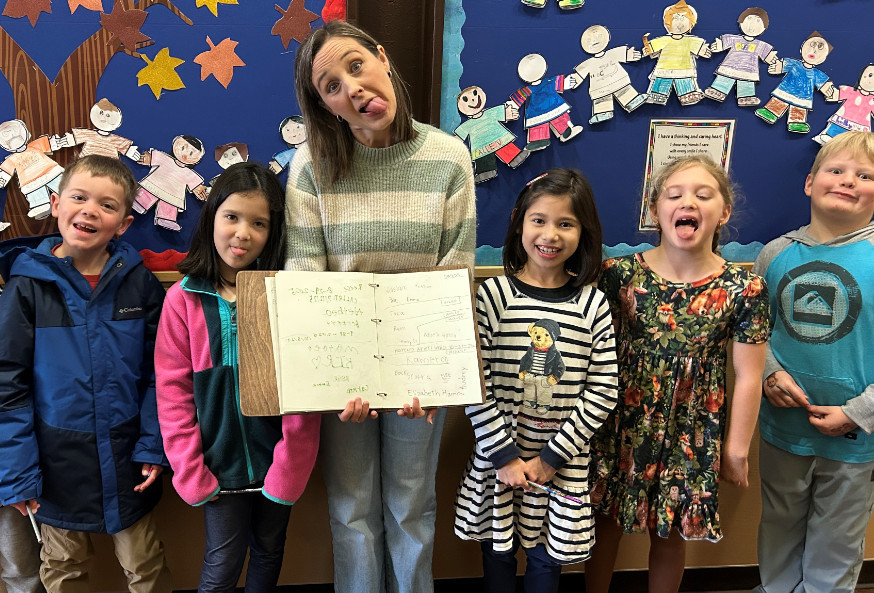 Students posing with teacher