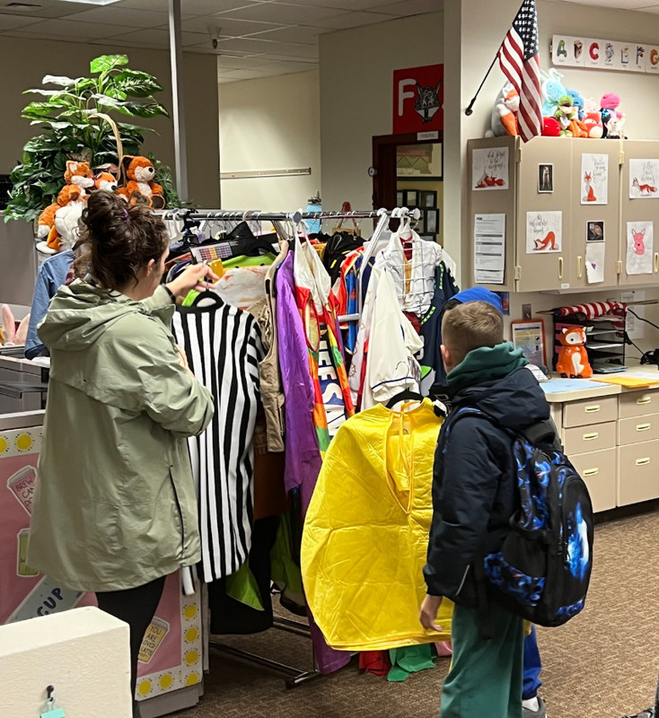 Students selecting costumes