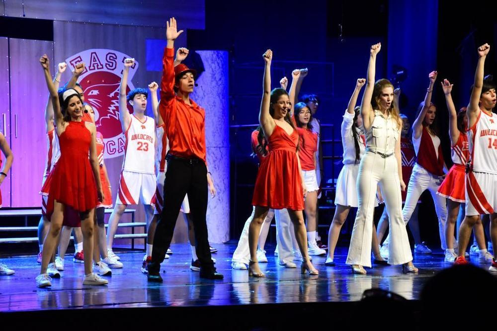 Students acting on stage