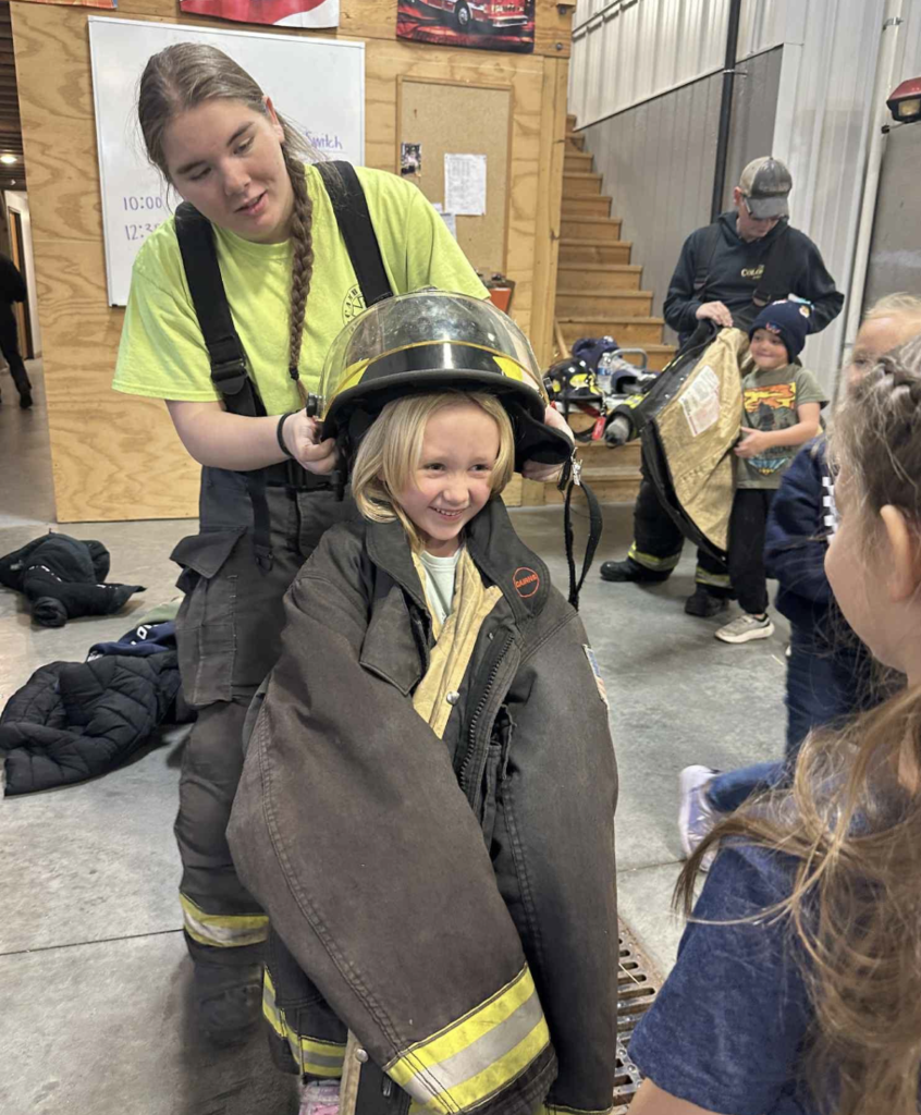 putting on the fire uniforms