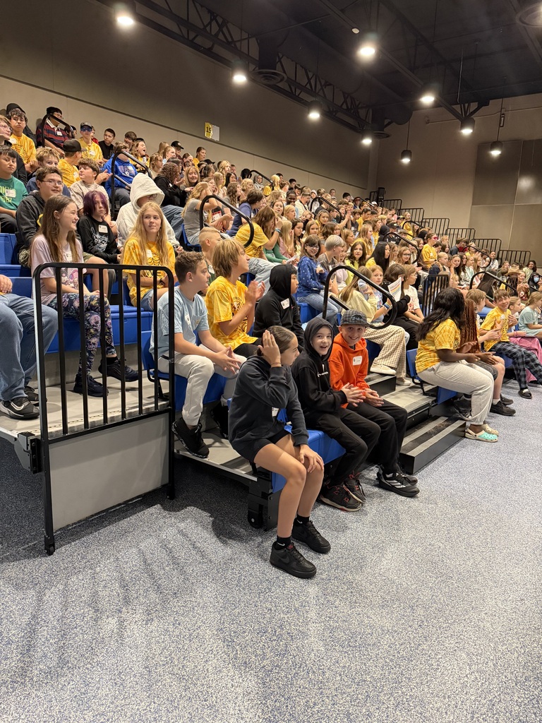6th grade students sitting in bleachers on the first day of school.