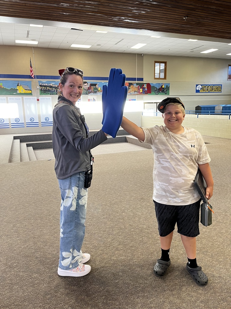 Student giving a high five to Dr. Pagel