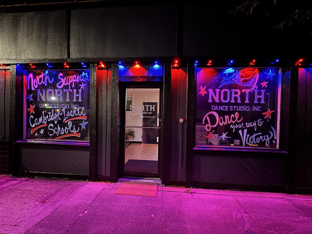 Front face of North Dace Studio, Inc. Window are decorated with Cambridge-Isanti Homecoming spirit.