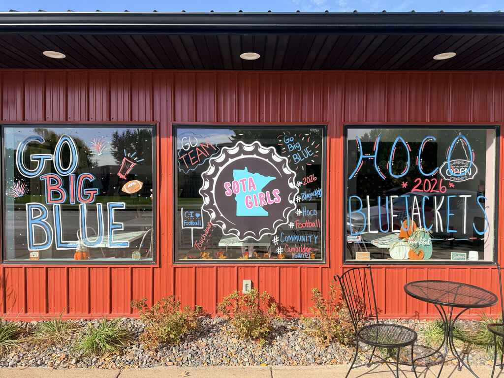 SOTA GIRLS business front, that has been hand-painted store windows display message reading, "Go Big Blue HOCO 2026 Bluejackets," celebrating Homecoming.
