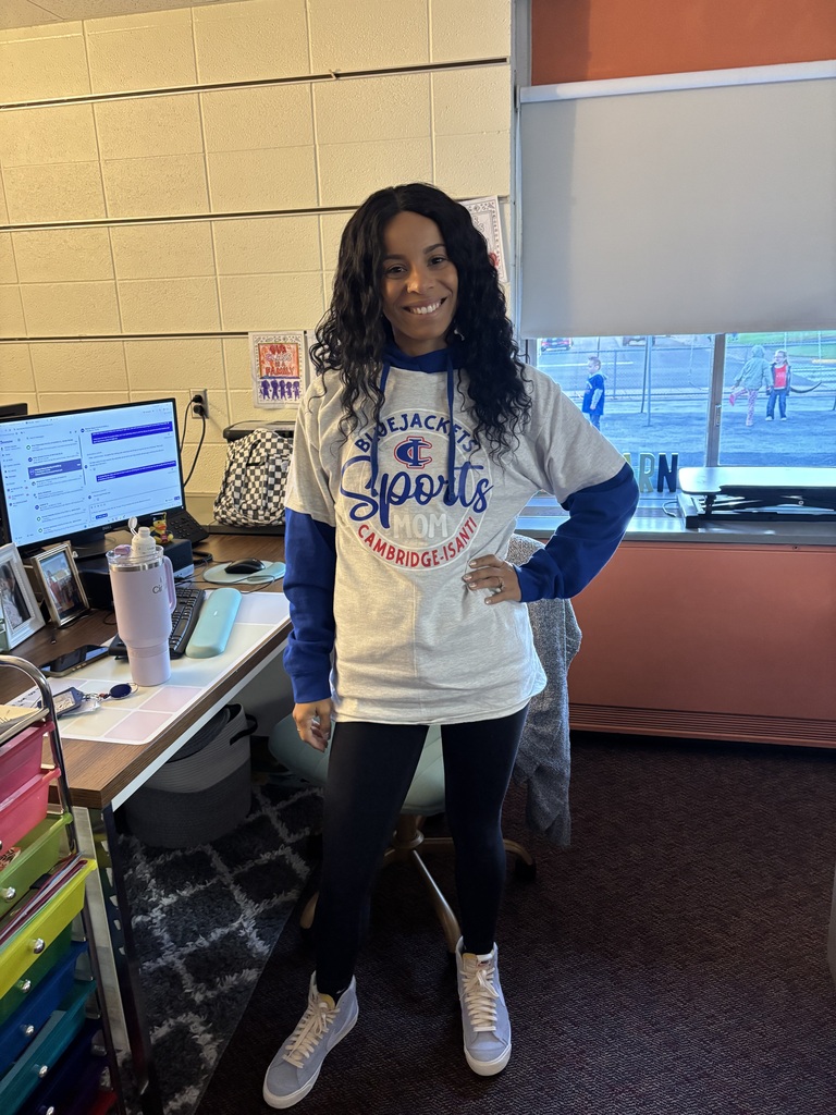 Teacher smiles while wearing C-I Bluejacket Sports Mom shirt. 