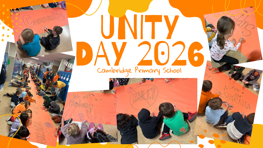 Photo collage titled "UNITY DAY 2026 Cambridge Primary School" in bold orange font over a white background with abstract orange shapes. Surrounding the text are multiple photos of young students gathered in hallways and sitting on the floor around long rolls of bright orange banner paper. They are using markers to draw pictures, trace handprints, and write uplifting words such as "Community," "We All Belong," "Courage," "Support," "Show Your Sparkle," and a "No Bullying" symbol.