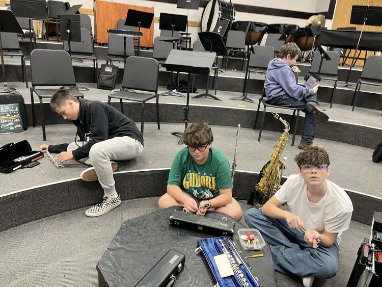 JH students learning how to clean and maintain musical instruments