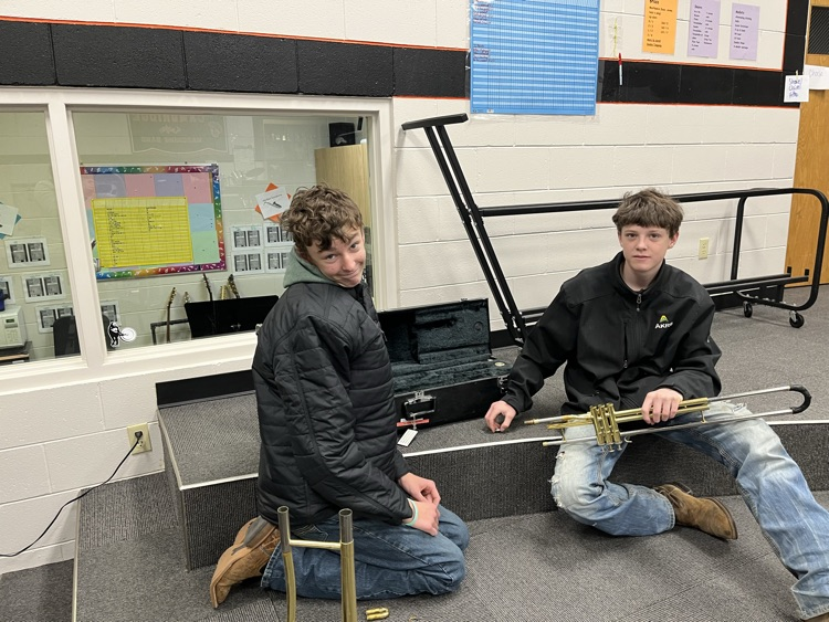 JH students learning how to clean and maintain musical instruments