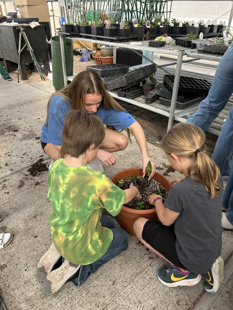 kindergarten helping FFA greenhouse 2026