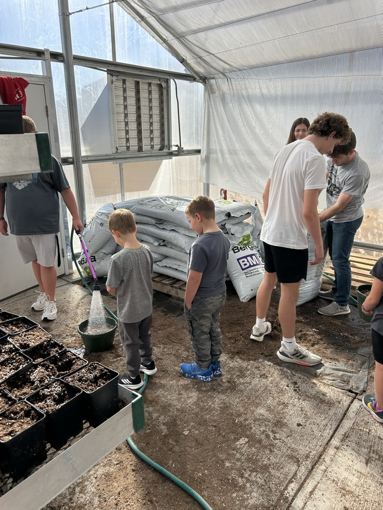 kindergarten helping FFA greenhouse 2026