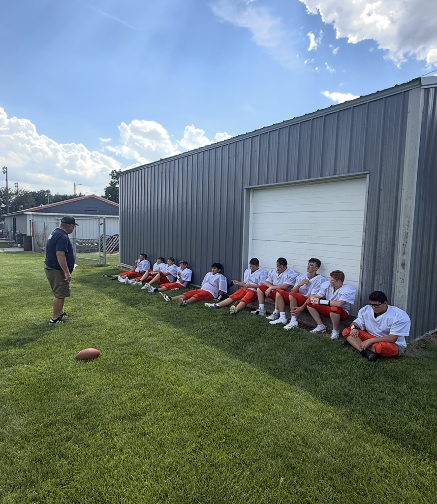 Coach Paulsen talking to the JH football team about rules, responsibilities, and sportsmanship.