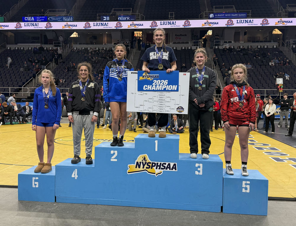 Girls Wrestling Podium - Rylie Meagher stands on the sixth step of the podium
