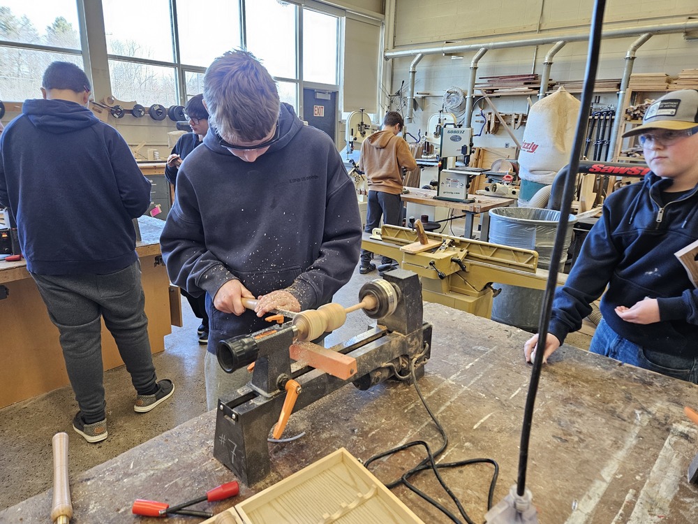 DDP Class Student Using A Lathe To Create A Top