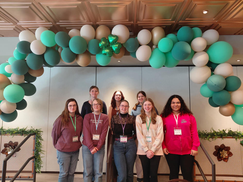 Students Samantha MacMurray, Sophia Seitz, Alexis Albrecht, Emma Wilson, Kraygan Poole, Adalyn Whitby, Abigail Miller, and Lily Phelps at STEAM Symposium