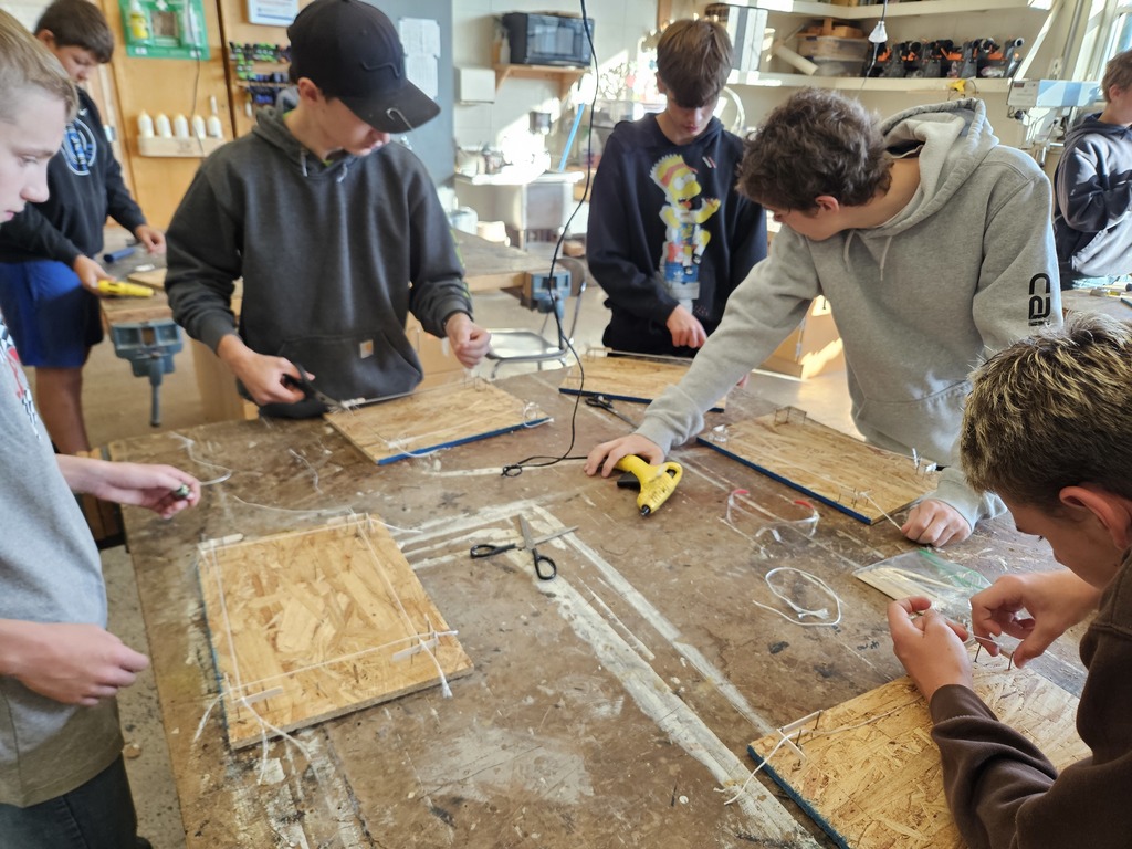 Mr. Petrie's Residential Structures class spent the last 2 weeks learning about plot plans and building lines. Students modeled a building layout using plywood, nails and string, keeping a critical eye on accurate measurements. Later, they got into groups of 4 and applied this knowledge to a full scale site. Groups took time to layout a perfectly square 8' x 12' building. They drove stakes and leveled line just like the professionals in the real world. By the end, students were ready for a (hypothetical) excavator to start digging! 