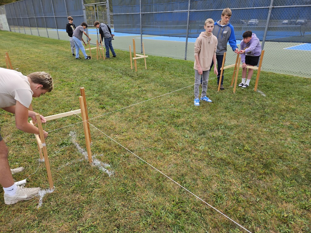 Mr. Petrie's Residential Structures class spent the last 2 weeks learning about plot plans and building lines. Students modeled a building layout using plywood, nails and string, keeping a critical eye on accurate measurements. Later, they got into groups of 4 and applied this knowledge to a full scale site. Groups took time to layout a perfectly square 8' x 12' building. They drove stakes and leveled line just like the professionals in the real world. By the end, students were ready for a (hypothetical) excavator to start digging! 