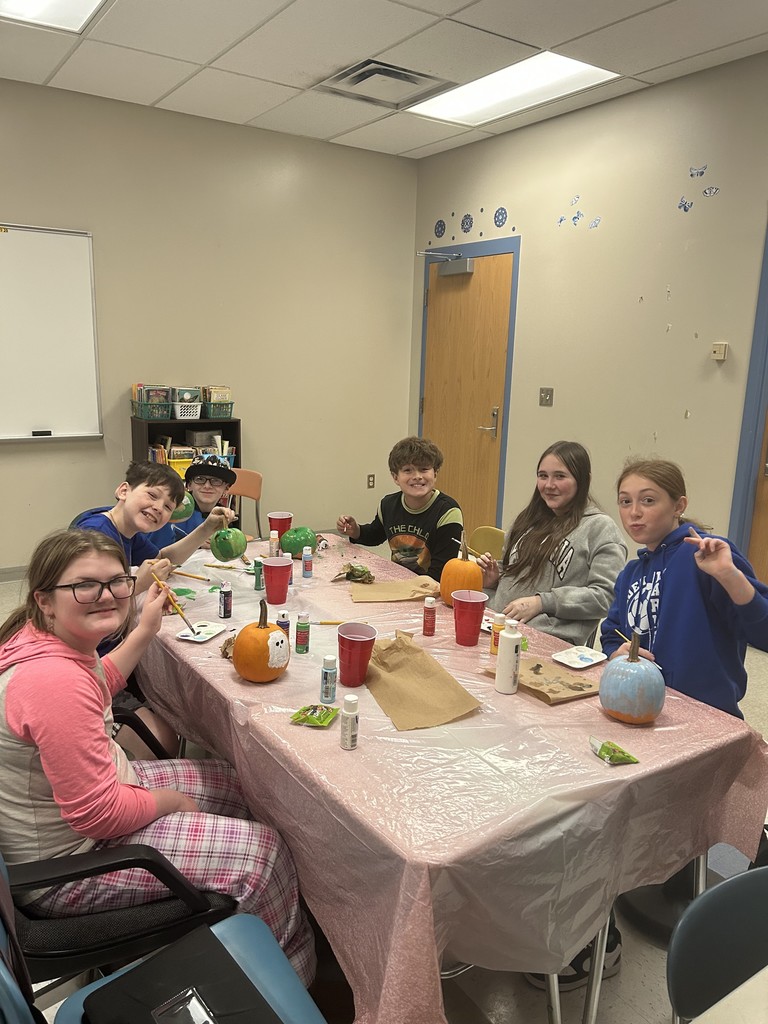 Mrs. Christmas's ELA students painting pumpkins
