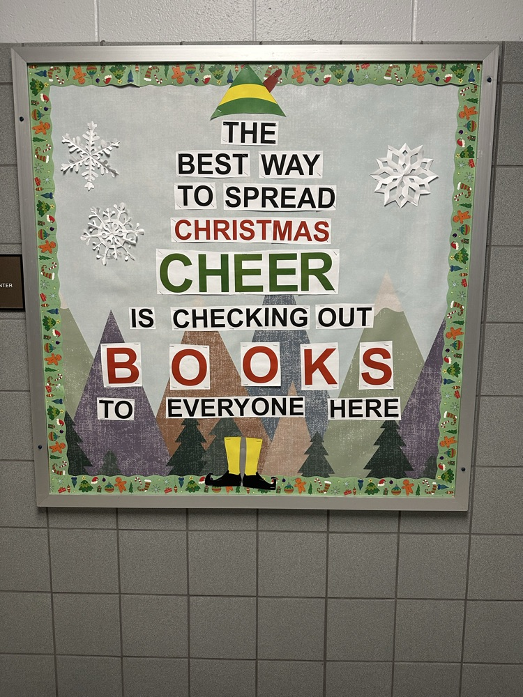 Buddy The Elf Bulletin Board that Says The Best Way To Spread Christmas Cheer IS Checking Out Books To Everyone Here