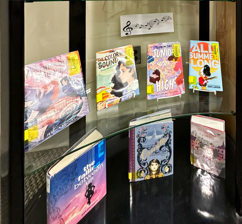 Music in Our Schools Month Display for our students featuring fiction books about music, bottom two shelves. 