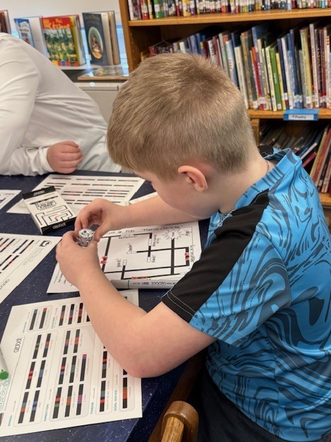 3rd Grade IFA Group at McVille working with Ozobots