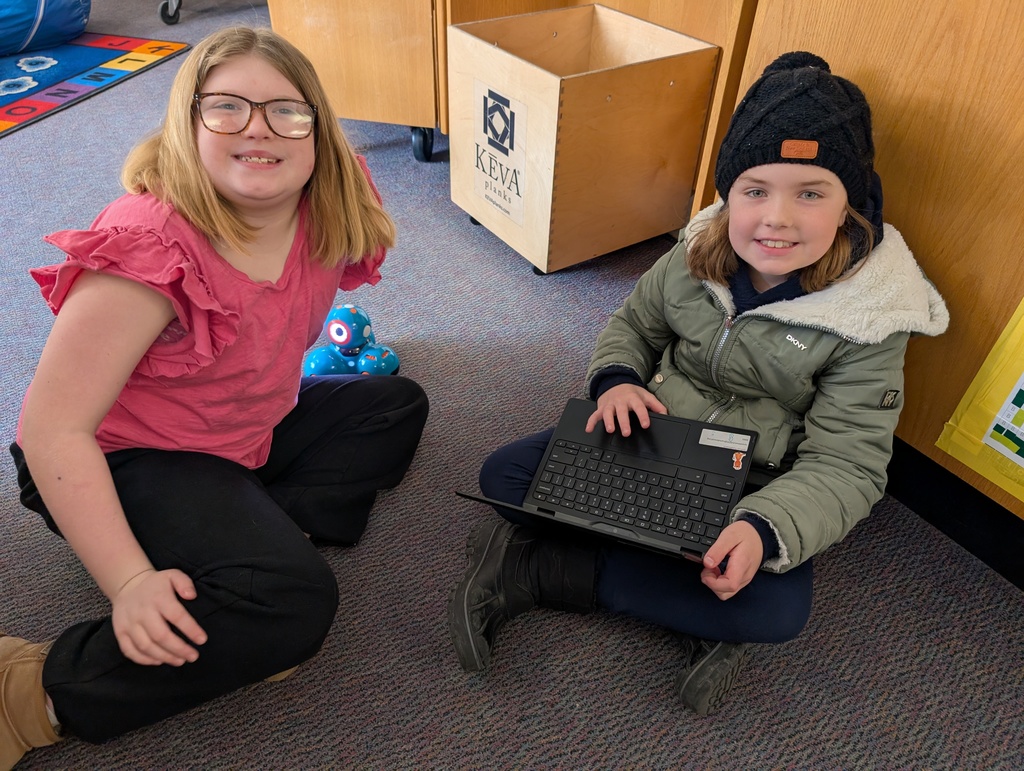 Pairings of students participating in a Robotics activity with Dash and Dot Robots. Each photo has two students and the laptop they're using to  program the robots. 